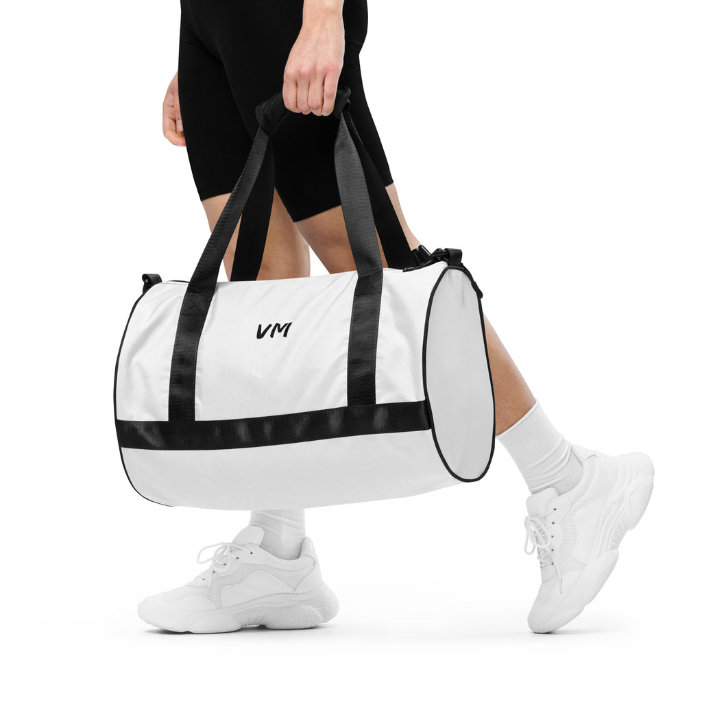 VM Spacial Version Gym Bag Ready to get your fitness on? Add some punch to pumping iron with this all-over print gym bag. Made from 100% polyester and sturdy, water-resistant fabric, this bag is fun meets function. And it’s got pockets! • 100% polyester •