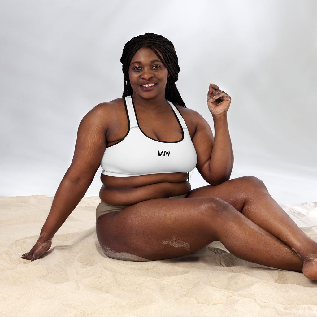 VM's Padded Sports Bra Get the perfect bra for your workouts! This comfy bra has a soft moisture-wicking fabric, extra materials in shoulder straps, and removable padding for maximum support. • 75% recycled polyester, 25% elastane for production in the US