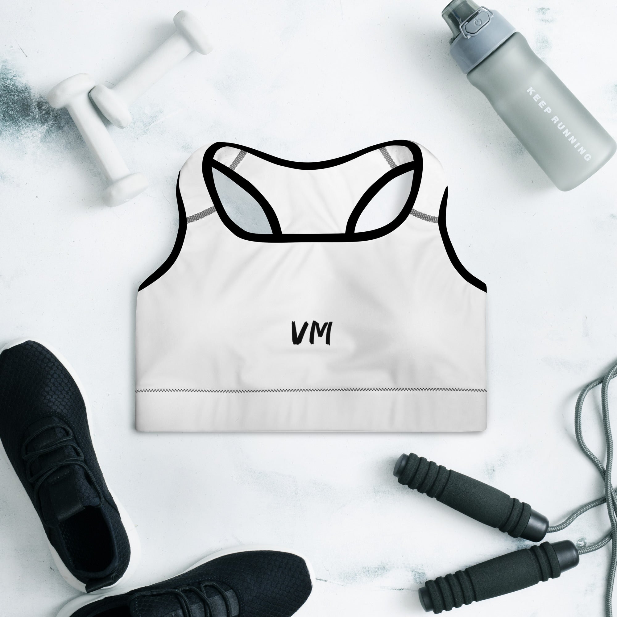 VM's Padded Sports Bra Get the perfect bra for your workouts! This comfy bra has a soft moisture-wicking fabric, extra materials in shoulder straps, and removable padding for maximum support. • 75% recycled polyester, 25% elastane for production in the US