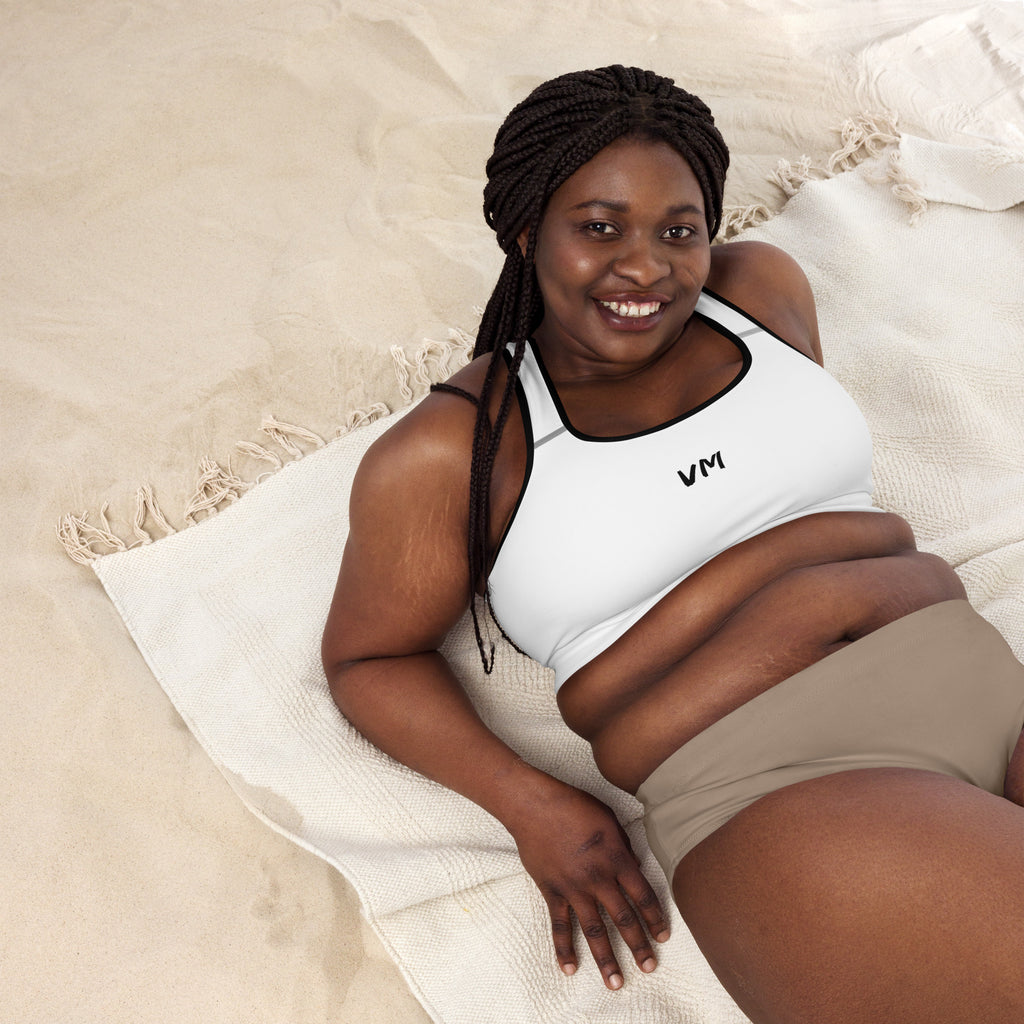 VM's Padded Sports Bra Get the perfect bra for your workouts! This comfy bra has a soft moisture-wicking fabric, extra materials in shoulder straps, and removable padding for maximum support. • 75% recycled polyester, 25% elastane for production in the US