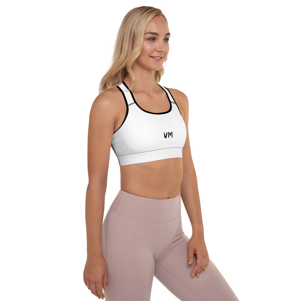 VM's Padded Sports Bra Get the perfect bra for your workouts! This comfy bra has a soft moisture-wicking fabric, extra materials in shoulder straps, and removable padding for maximum support. • 75% recycled polyester, 25% elastane for production in the US