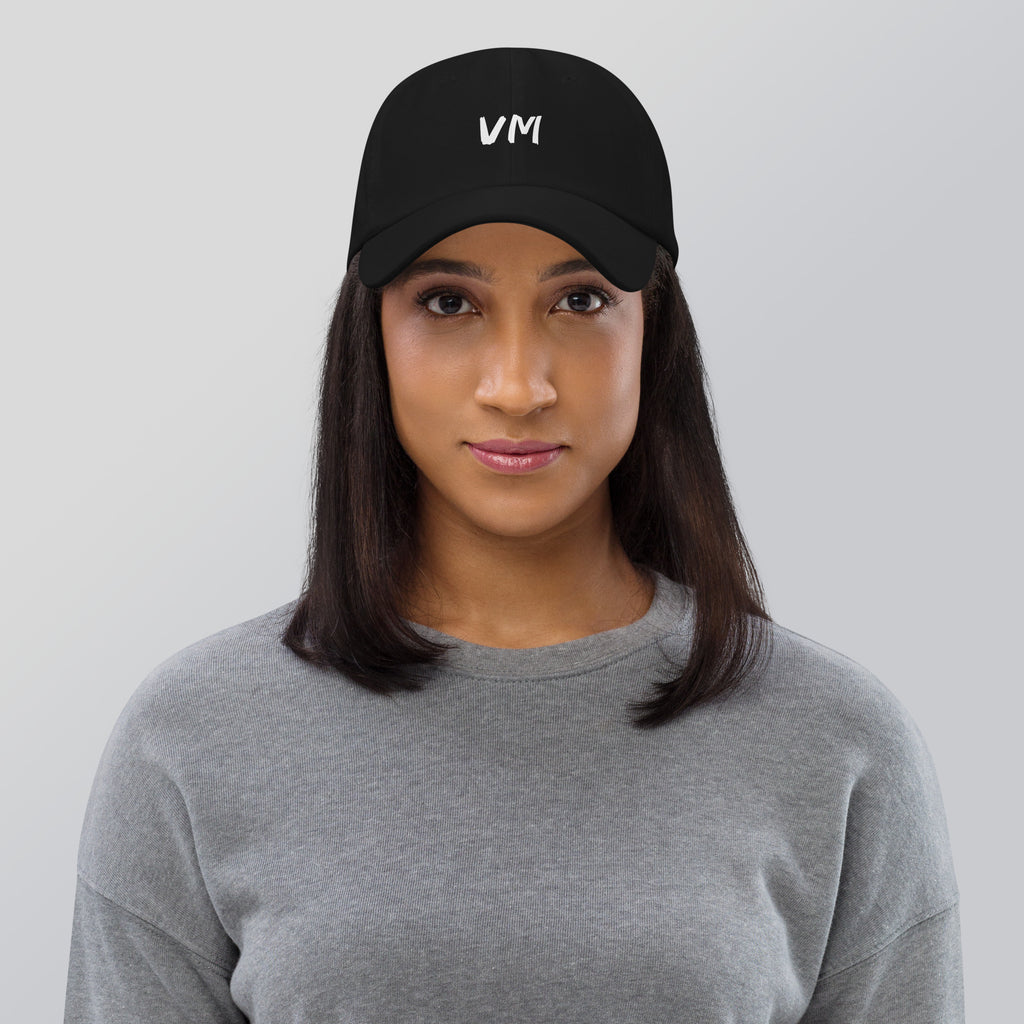 VM OFFICIAL HAT VM hats aren't just for everyone. This one's got a low profile with an adjustable strap and curved visor. • 100% chino cotton twill • Green Camo color is 35% chino cotton twill, 65% polyester • Unstructured, 6-panel, low-profile • 6 embroi