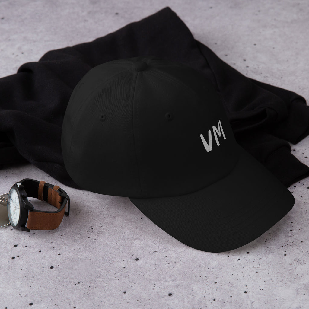 VM OFFICIAL HAT VM hats aren't just for everyone. This one's got a low profile with an adjustable strap and curved visor. • 100% chino cotton twill • Green Camo color is 35% chino cotton twill, 65% polyester • Unstructured, 6-panel, low-profile • 6 embroi