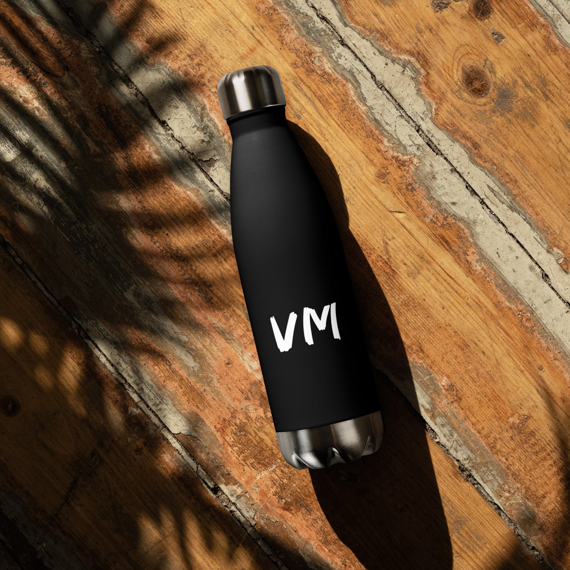 VM Stainless Steel Water Bottle This 17-ounce, double-walled stainless steel water bottle is perfect for your daily outings. It will keep your drink of choice hot or cold for hours. It also features an odor- and leak-proof cap. Throw it in your car's cup