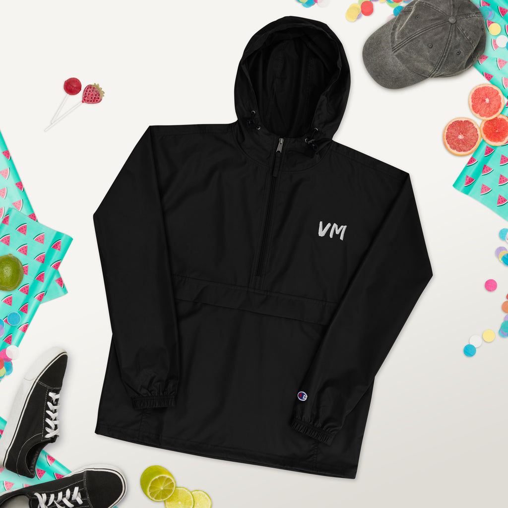 VM Official Embroidered Champion Packable Jacket Protect yourself from the elements with this Champion packable jacket. This wind and rain resistant polyester jacket with a detailed embroidery design has a practical hood, front kangaroo pocket, and zipped