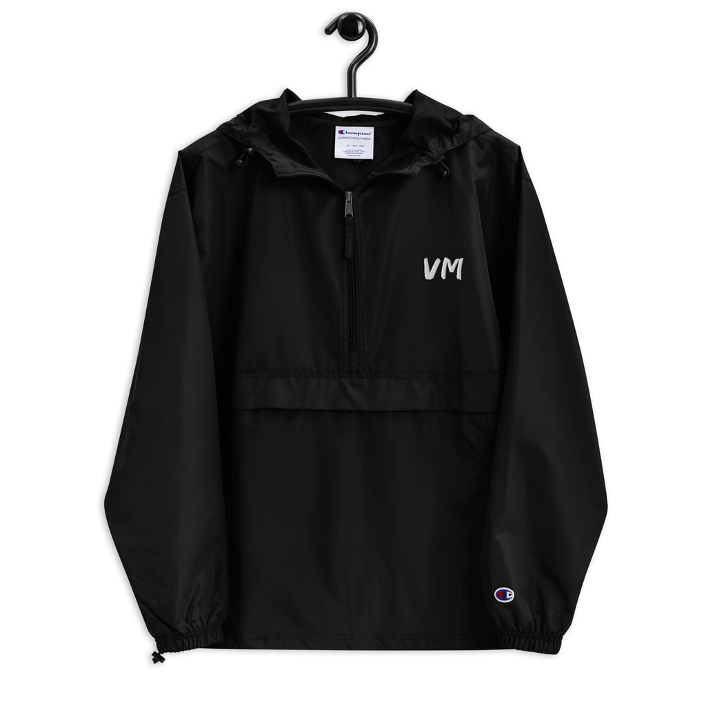 VM Official Embroidered Champion Packable Jacket Protect yourself from the elements with this Champion packable jacket. This wind and rain resistant polyester jacket with a detailed embroidery design has a practical hood, front kangaroo pocket, and zipped