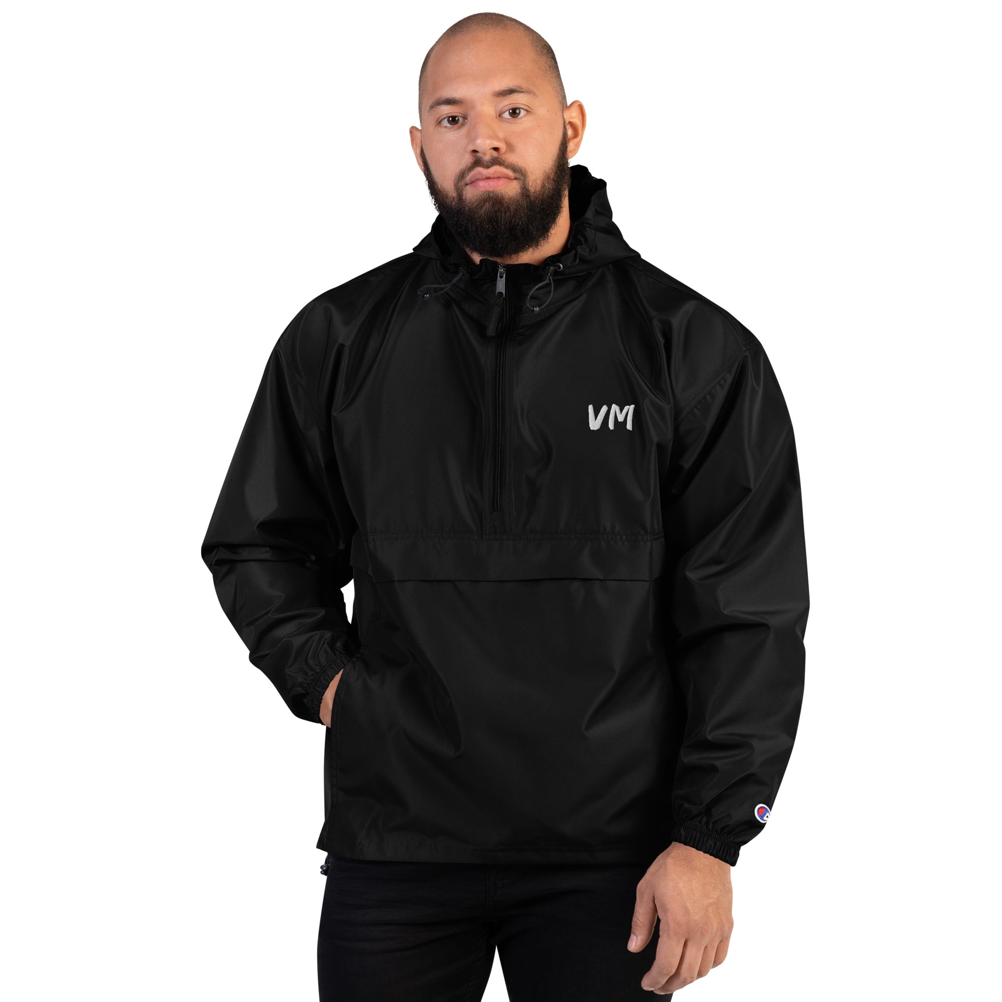 VM Official Embroidered Champion Packable Jacket Protect yourself from the elements with this Champion packable jacket. This wind and rain resistant polyester jacket with a detailed embroidery design has a practical hood, front kangaroo pocket, and zipped