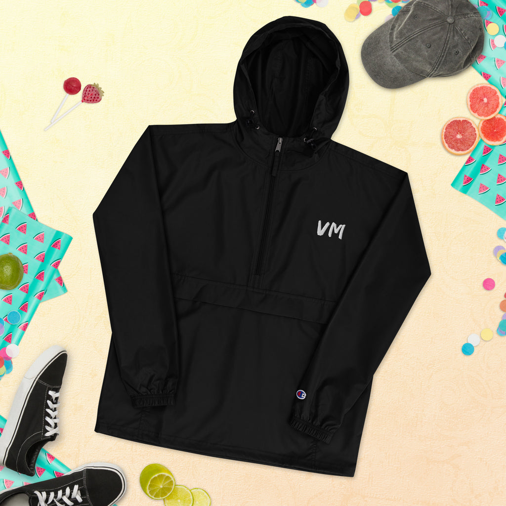 VM Official Embroidered Champion Packable Jacket Protect yourself from the elements with this Champion packable jacket. This wind and rain resistant polyester jacket with a detailed embroidery design has a practical hood, front kangaroo pocket, and zipped