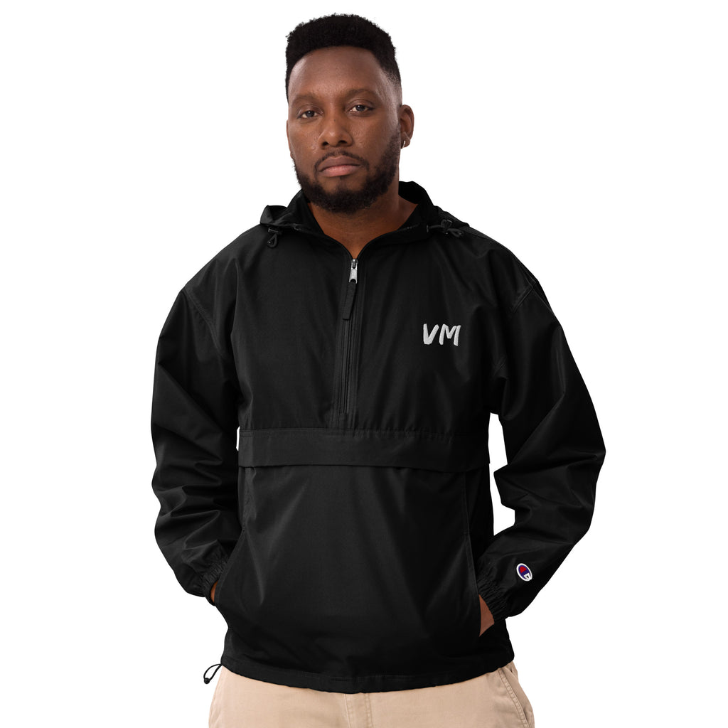 VM Official Embroidered Champion Packable Jacket Protect yourself from the elements with this Champion packable jacket. This wind and rain resistant polyester jacket with a detailed embroidery design has a practical hood, front kangaroo pocket, and zipped
