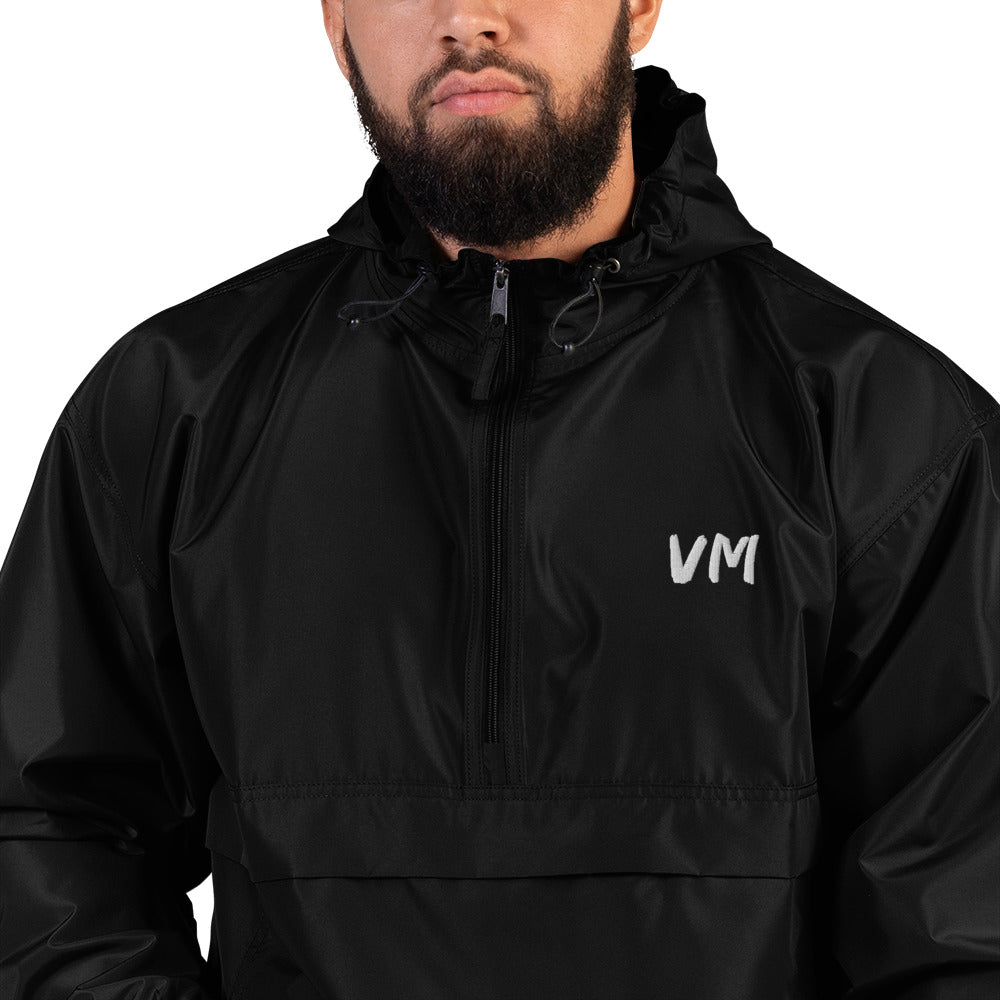 VM Official Embroidered Champion Packable Jacket Protect yourself from the elements with this Champion packable jacket. This wind and rain resistant polyester jacket with a detailed embroidery design has a practical hood, front kangaroo pocket, and zipped