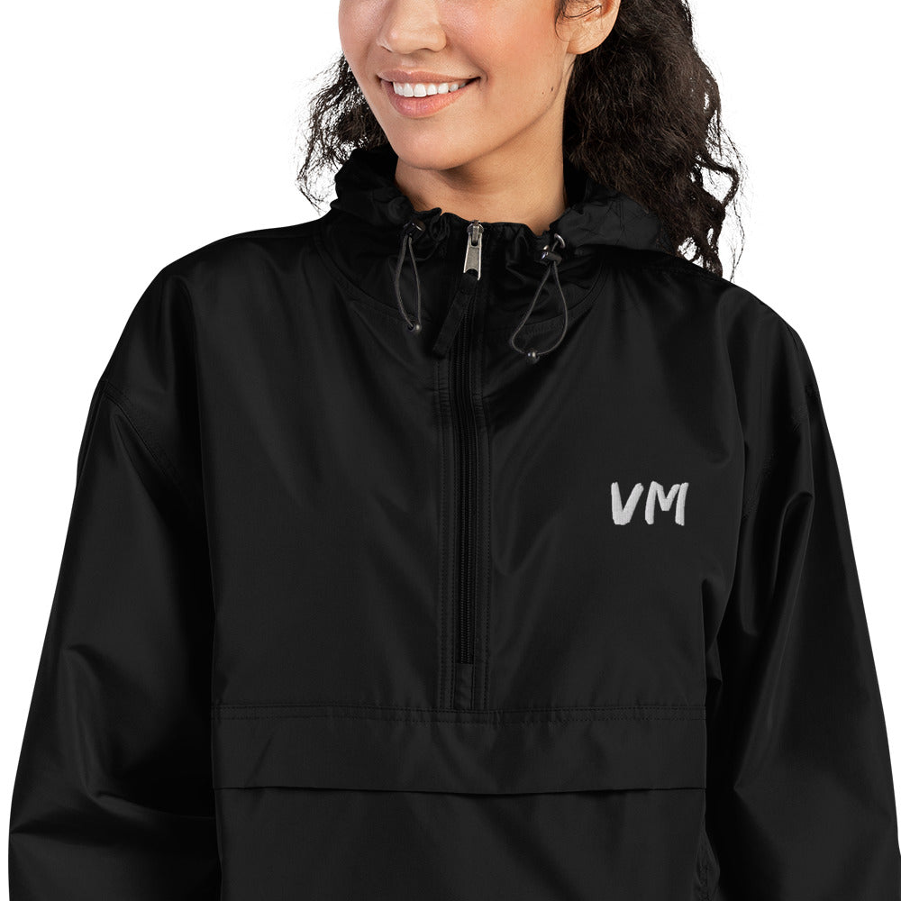 VM Official Embroidered Champion Packable Jacket Protect yourself from the elements with this Champion packable jacket. This wind and rain resistant polyester jacket with a detailed embroidery design has a practical hood, front kangaroo pocket, and zipped